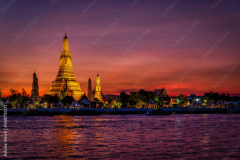 The Buddhist Temple Wat Arun during dusk, one of the most popular and beautiful tourist attractions of Bangkok, Thailand The Buddhist Temple Wat Arun during dusk, one of the most popular and beautiful tourist attractions of Bangkok, Thailand