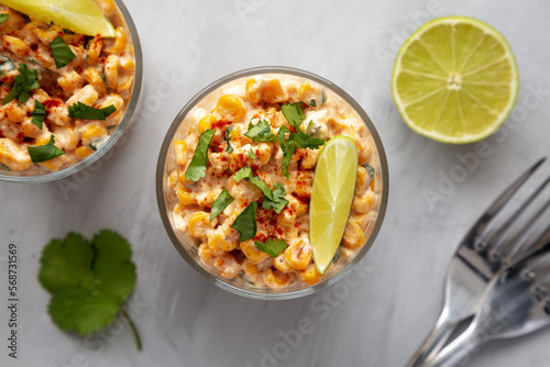 Homemade Mexican Corn Elote Esquites in Cups, top view. Flat lay, overhead, from above. Close-up.