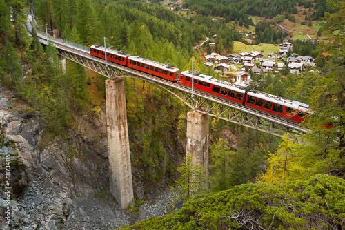 Zermatt, Switzerland. Gornergrat train on bridge photo