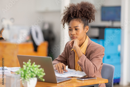 businesswoman analyzing statistics on laptop screen, working with financial graphs charts online, african american woman using business software for data analysis and project management concept, 