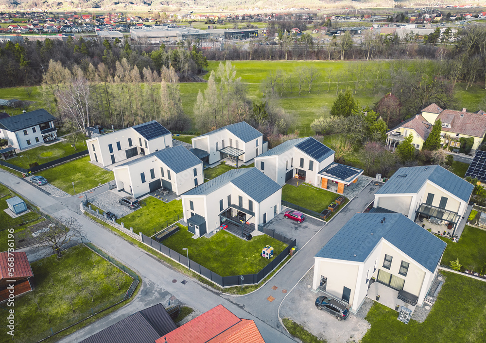 Aerial view of new modern residential area with identical white houses 