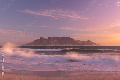 scenic view of table mountain tourist landmark in cape town south africa sunset on the beach photo