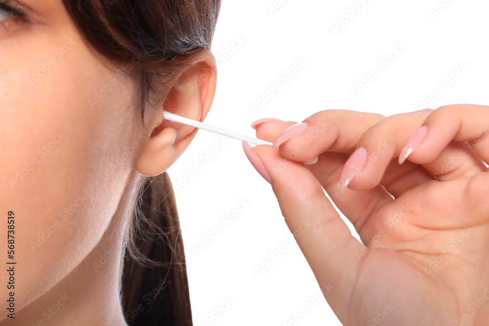 Woman cleaning ear with cotton swab on white background, closeup Woman cleaning ear with cotton swab on white background, closeup