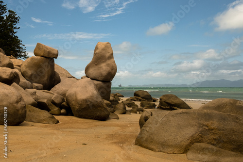 Rocks on a paradise beach with a clear blue ocean
