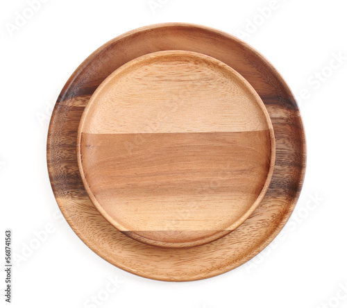 Wooden plates on white background, top view