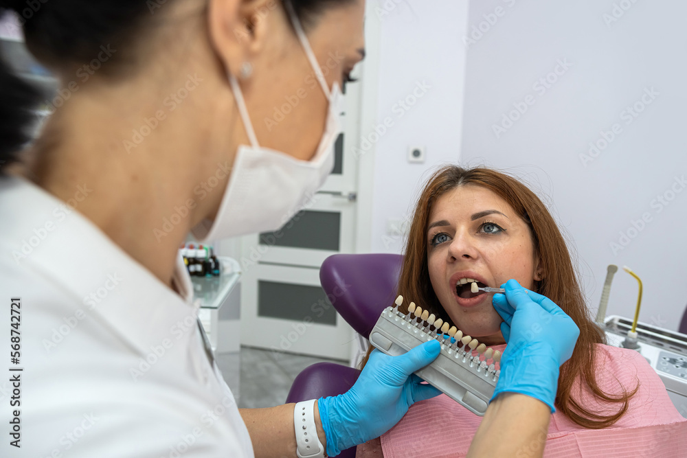 beautiful young patient came to a female dentist for caries treatment. beautiful young patient came to a female dentist for caries treatment.