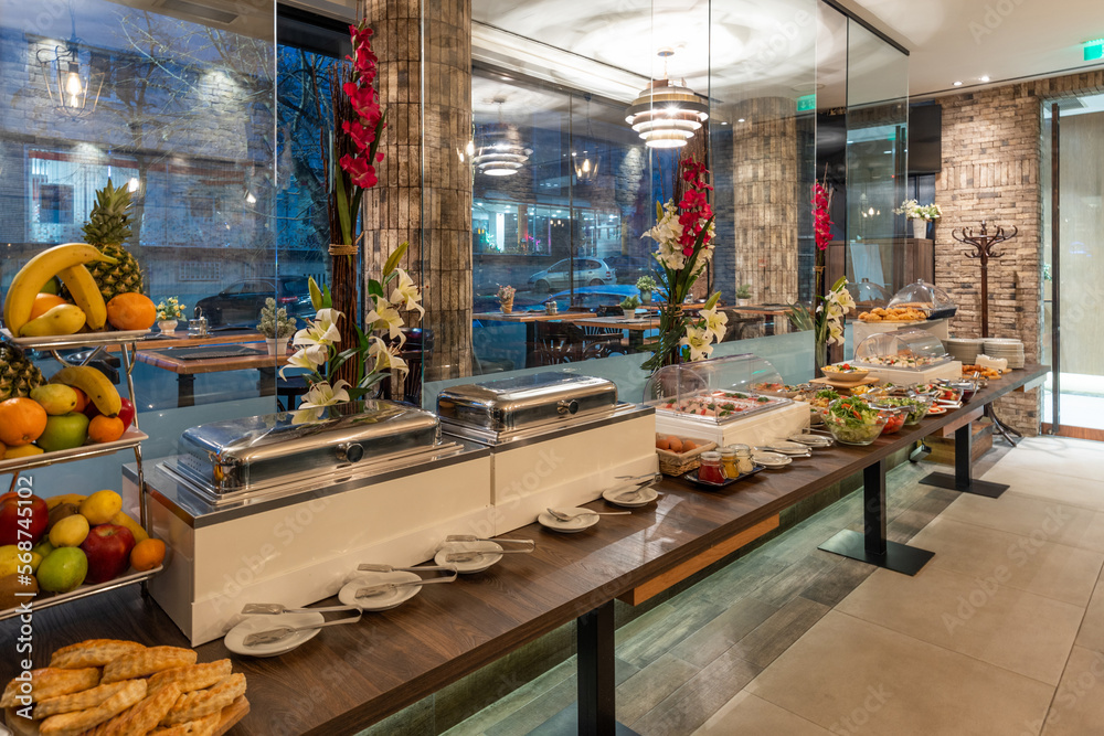 Restaurant interior with food buffet table