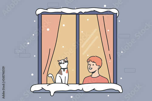 Smiling little boy child and cat sit in window look at street in winter. Happy kid with domestic pet indoors in cozy home. Vector illustration. 
