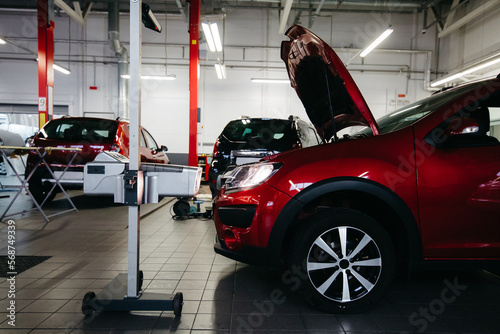 Close up checking and adjusting the headlights of a car's lighting system in auto repair service