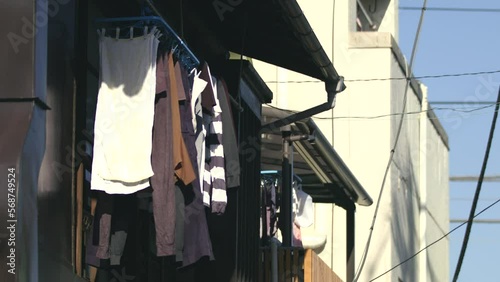 Laundries bring dried in the wind, with sunlights, from the old building's veranda 