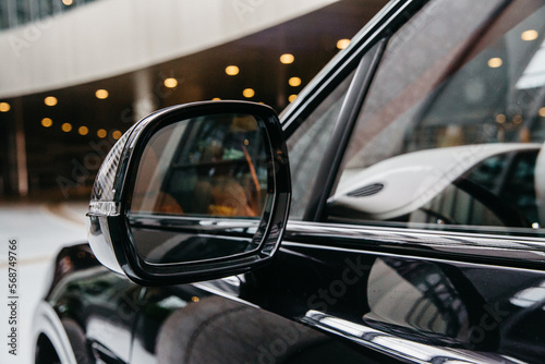 a mirror in a carbon body on a luxury SUV © AvokadoStudio
