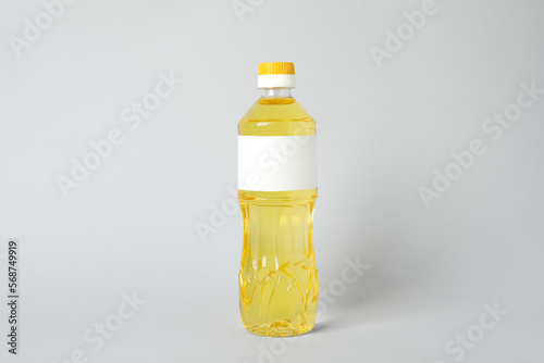 Bottle of cooking oil on light grey background