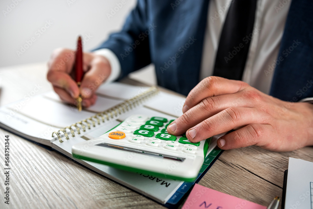 man work with finance graph and chart at office man work with finance graph and chart at office