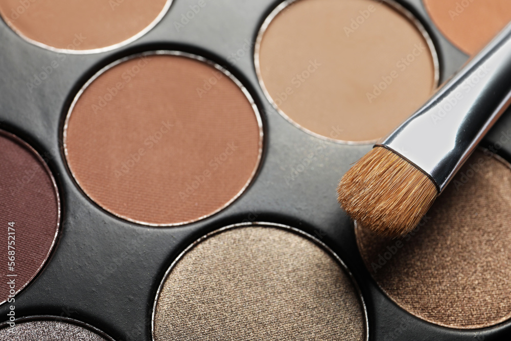 Beautiful eye shadow palette and brush as background, closeup Beautiful eye shadow palette and brush as background, closeup