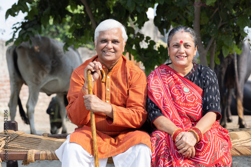 Old Asian man and woman sitting outdoor smiling. retirement life,