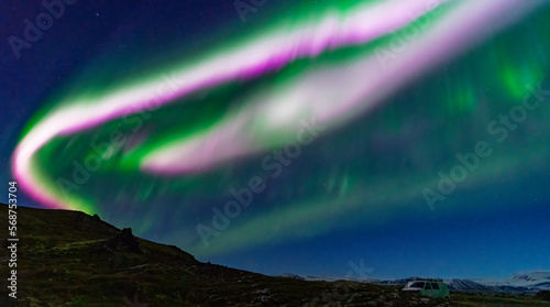 Awe aurora borealis with green and purple beams