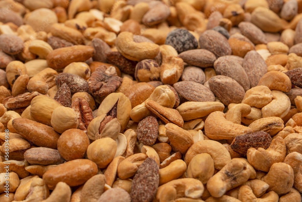 A group of almonds, pistachios, walnuts, macadamia, cashews. A group of almonds, pistachios, walnuts, macadamia, cashews.