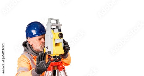 A builder in a hat and orange reflective fleece gives STOP sign on white background with space for text. Site engineer using modern surveying equipment isolate on white background © Iryna
