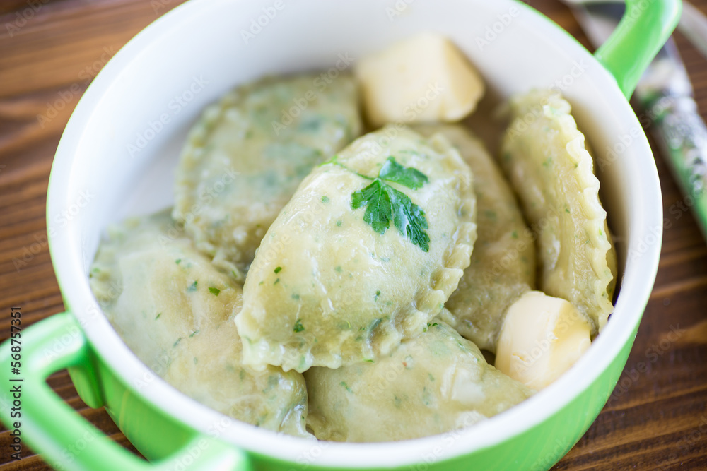 Boiled dumplings with stuffing inside, from dough with herbs Boiled dumplings with stuffing inside, from dough with herbs