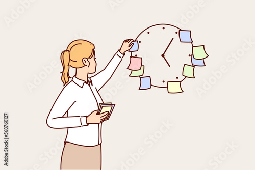 Business woman using stickers on clock to meet deadlines set by manager and launch project on time