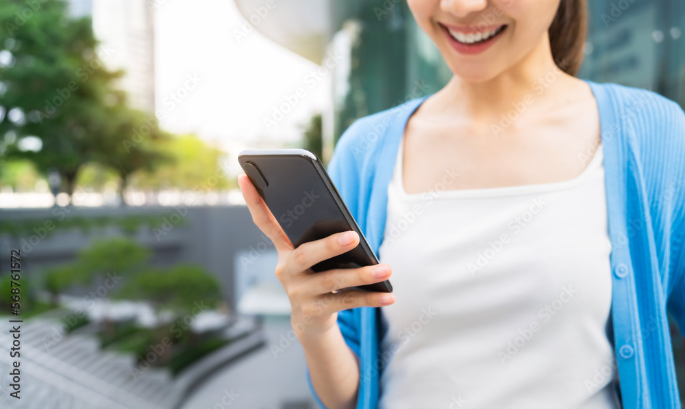 woman using smartphone in public areas, During leisure time. The concept of using the phone is essential in everyday life. woman using smartphone in public areas, During leisure time. The concept of using the phone is essential in everyday life.