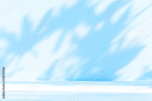 Fototapeta Naklejka Na Ścianę i Meble -  Abstract blue studio background for product presentation. Empty room with shadows of window and flowers and palm leaves . 3d room with copy space. Summer concert. Blurred backdrop.