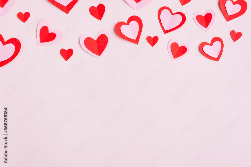 Red and Pink Paper Hearts on pink background, Heart shape papercut , Happy Valentine's day