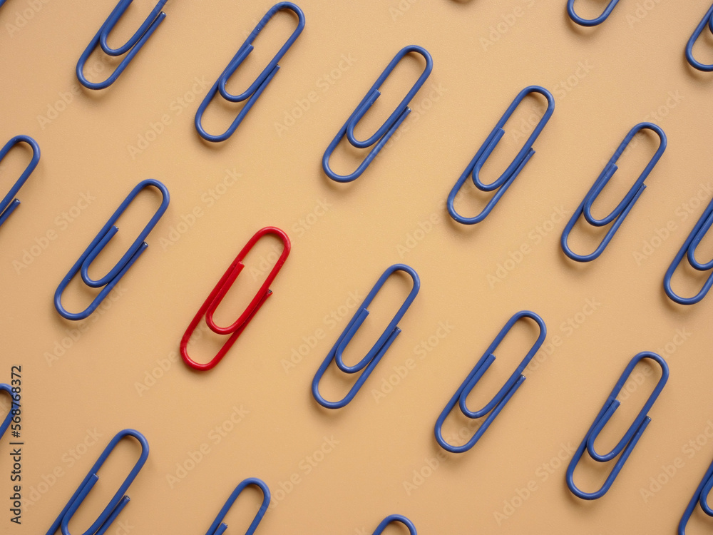 Blue paperclips and one red. Be different, be unique.