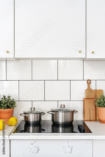 glass ceramic induction stove at cozy kitchen, cooking concept