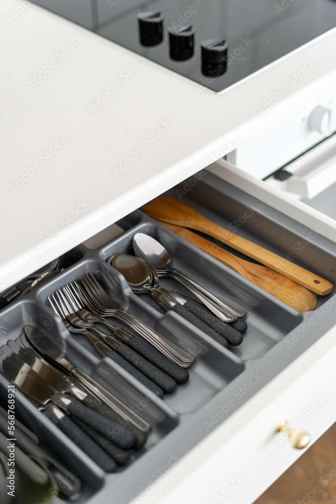 Fototapeta premium open wooden box with cutlery tray, storage concept