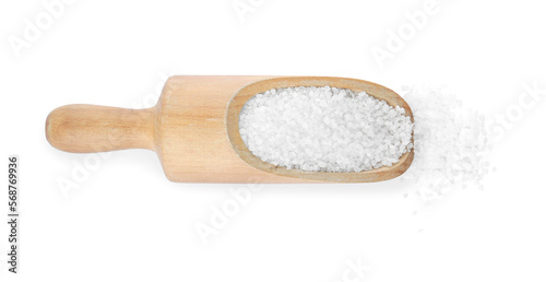 Wooden scoop with natural sea salt on white background, top view
