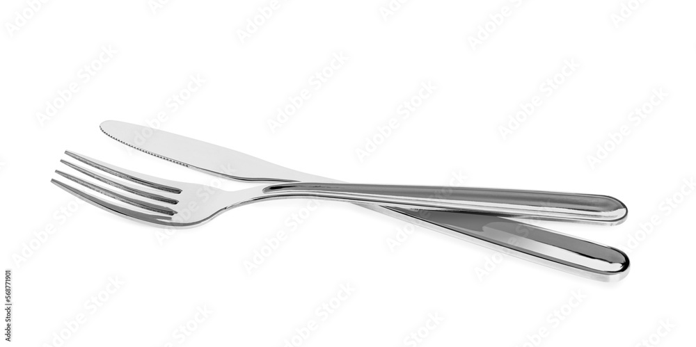 Knife and fork isolated on white. Stylish shiny cutlery set Knife and fork isolated on white. Stylish shiny cutlery set