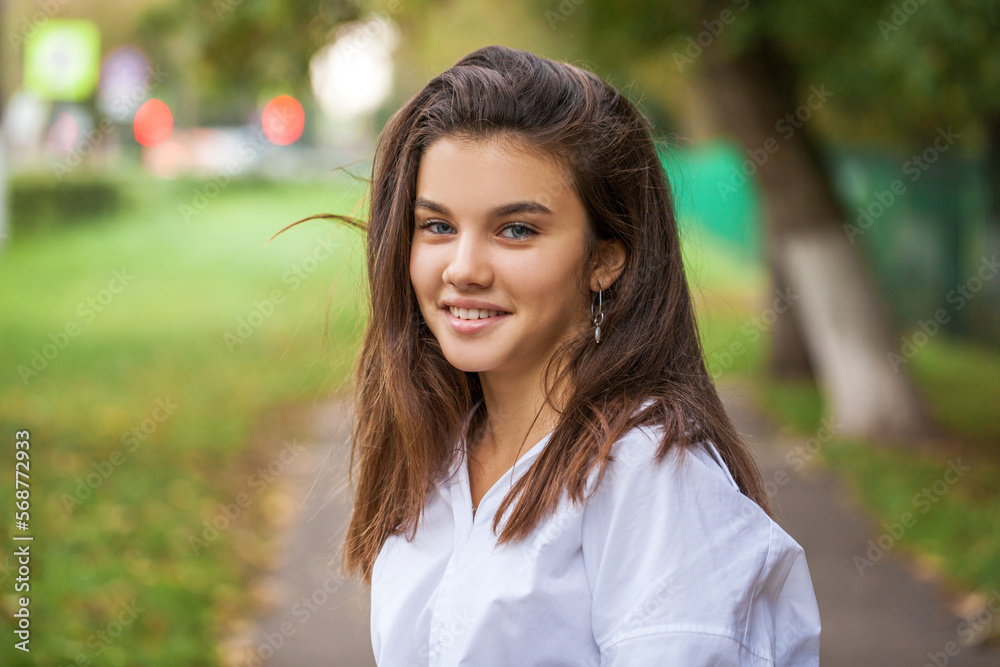 Portrait of a teenage girl, summer park outdoors