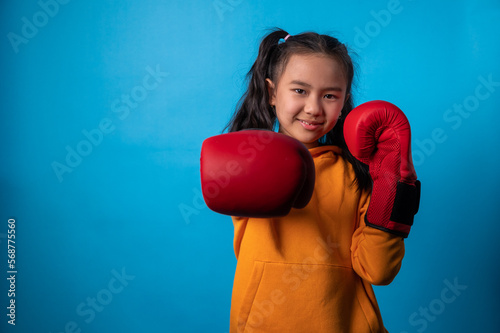 the studio isolated a portrait image of the girl wearing the boxing gloves © TimeStopper