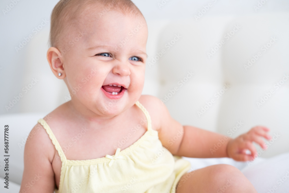 portrait of cute baby girl smiling with first milk teeth. Healthy newborn child portrait of cute baby girl smiling with first milk teeth. Healthy newborn child