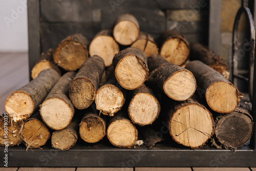 Closeup of chopped firewood. Firewood stacked and prepared. Natural wooden backgroun