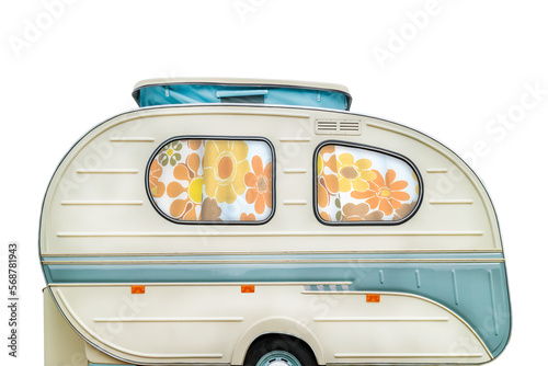 Vintage seventies white caravan with flower curtains