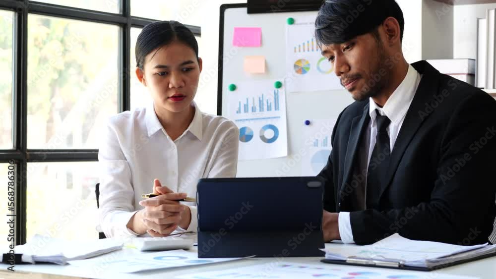Accounting team manager working with cash flow chart and balance sheet, asset paperwork with stock market monthly statics Accounting team manager working with cash flow chart and balance sheet, asset paperwork with stock market monthly statics
