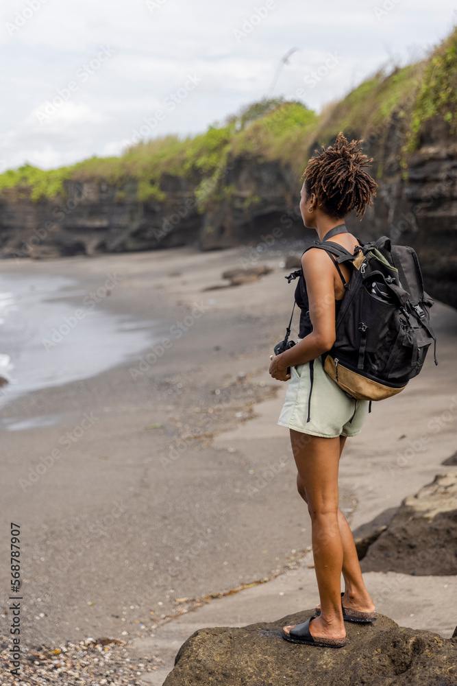 Indonesia, Bali, Female tourist looking at sea view