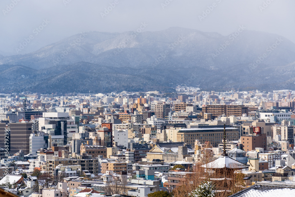 Kyoto City skyline panoramic view with snow in winter.