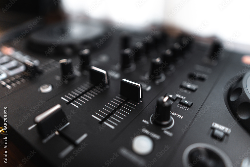 Close-up dj controller and Sound mixing desk at home Close-up dj controller and Sound mixing desk at home