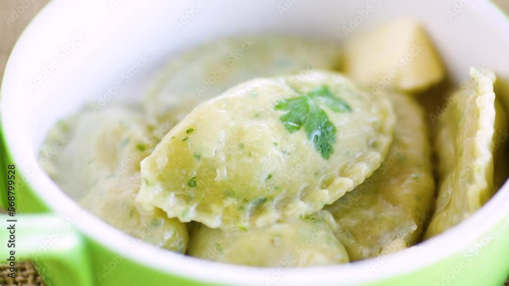 Boiled dumplings with stuffing inside, from dough with herbs Boiled dumplings with stuffing inside, from dough with herbs