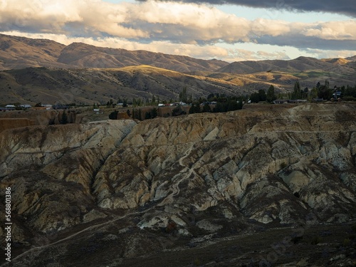 Arid barren badland, wild west desert landscape of Bannockburn Sluicings in former goldmine in Central Otago New Zealand