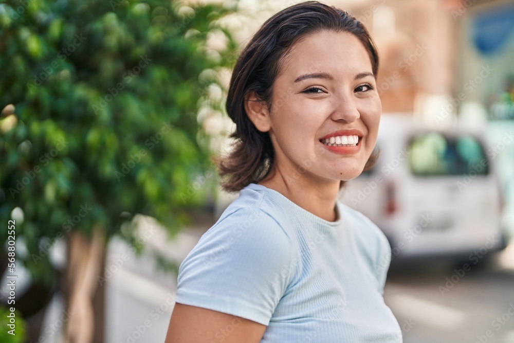 Young hispanic woman smiling confident standing at street Young hispanic woman smiling confident standing at street