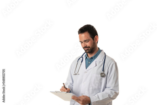 Medical services. Smiling young male doctor In white uniform and stethoscope writing a medical report on a folder isolated on white background
