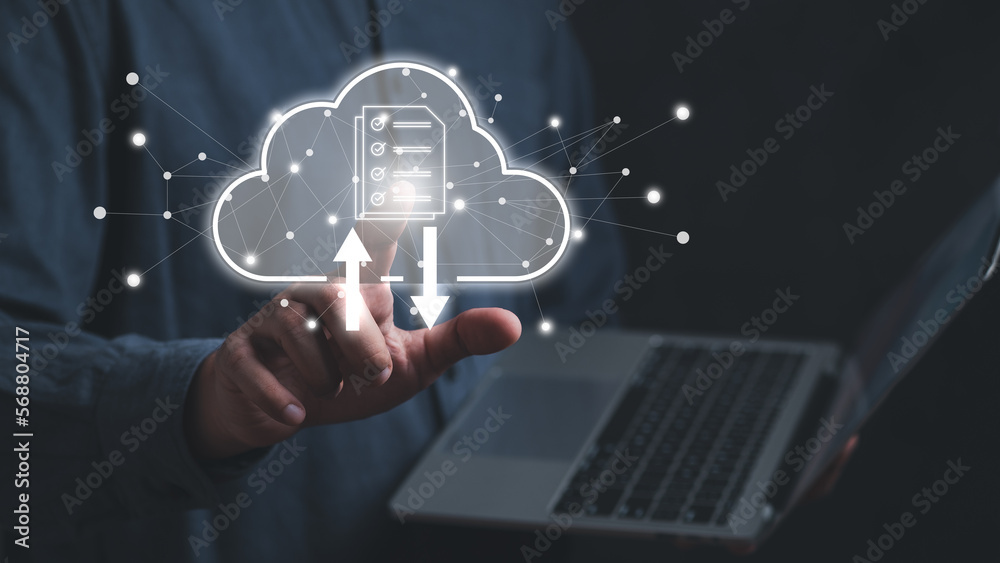 man holding and using Laptop with finger pointing cloud computing diagram. Cloud technology. Data storage. Networking and internet service concept. man holding and using Laptop with finger pointing cloud computing diagram. Cloud technology. Data storage. Networking and internet service concept.