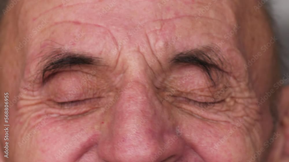 close up portrait of smiling caucasian old man looking at camera.selective focus.slow motion.real elderly people.lifestyle of elderly people close up portrait of smiling caucasian old man looking at camera.selective focus.slow motion.real elderly people.lifestyle of elderly people