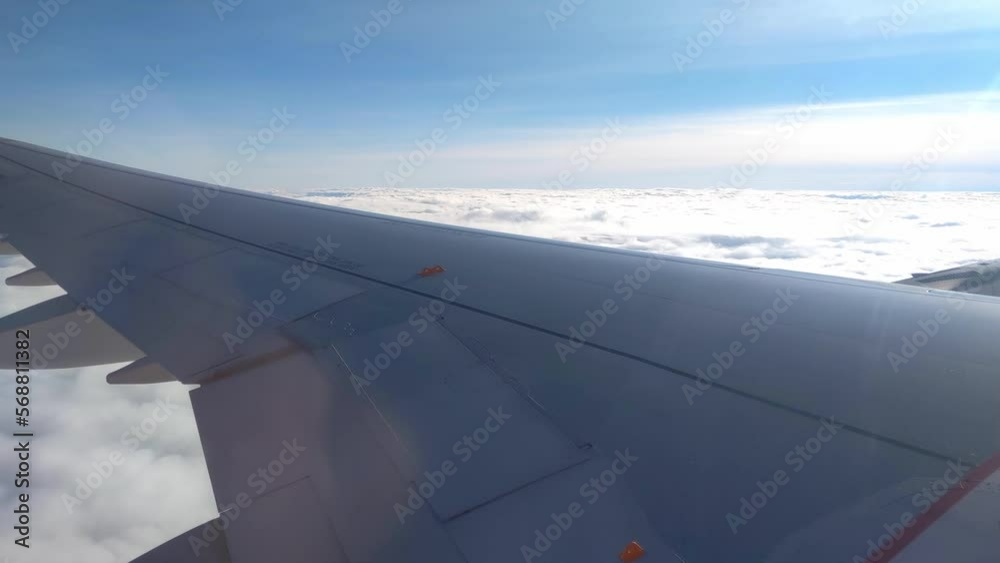 View from the window of the flying plane on the clouds View from the window of the flying plane on the clouds