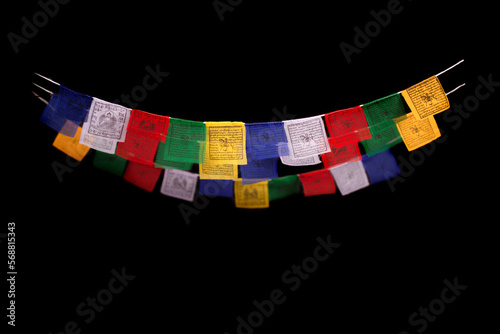 Tibetan prayer flags isolate on black photo