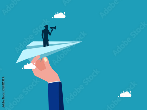 Businessman holding a megaphone on a paper plane. Help support advertising and marketing. business concept vector © Nastudio